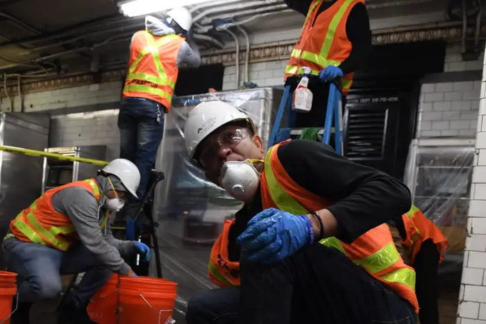 MTA employees involved in cleaning efforts — the only group permitted to wear masks